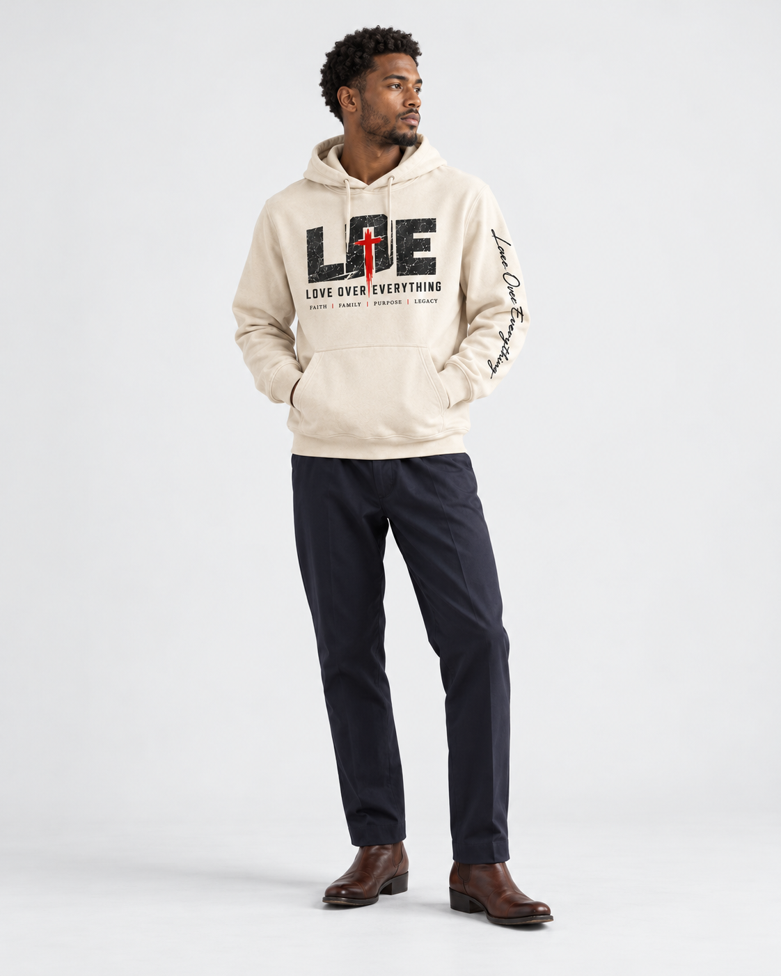 Model wearing the white Love Over Everything hoodie
