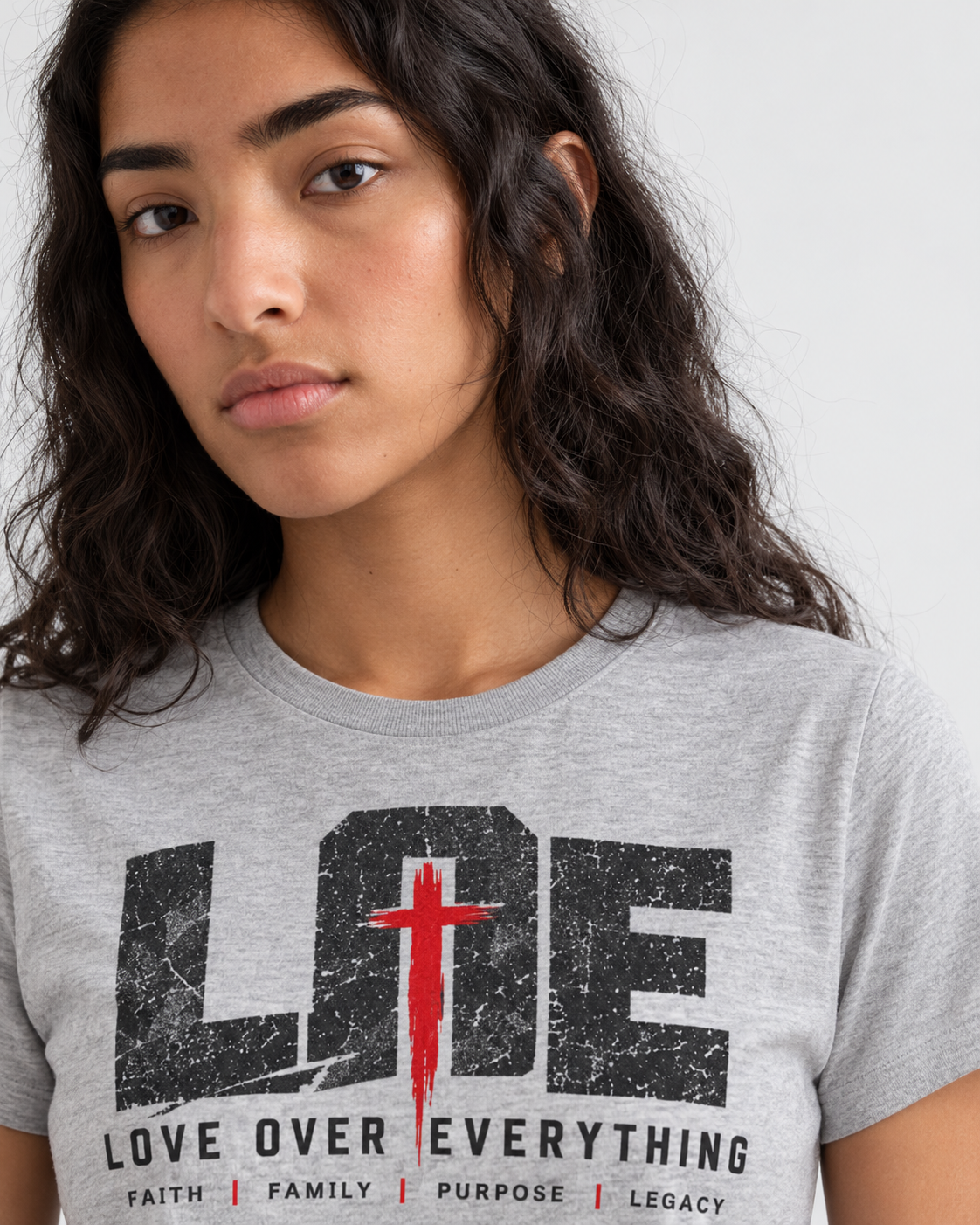 Model wearing the gray Love Over Everything T-shirt