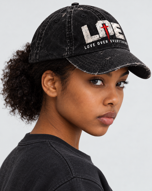 Model wearing the black Love Over Everything cap | color:black